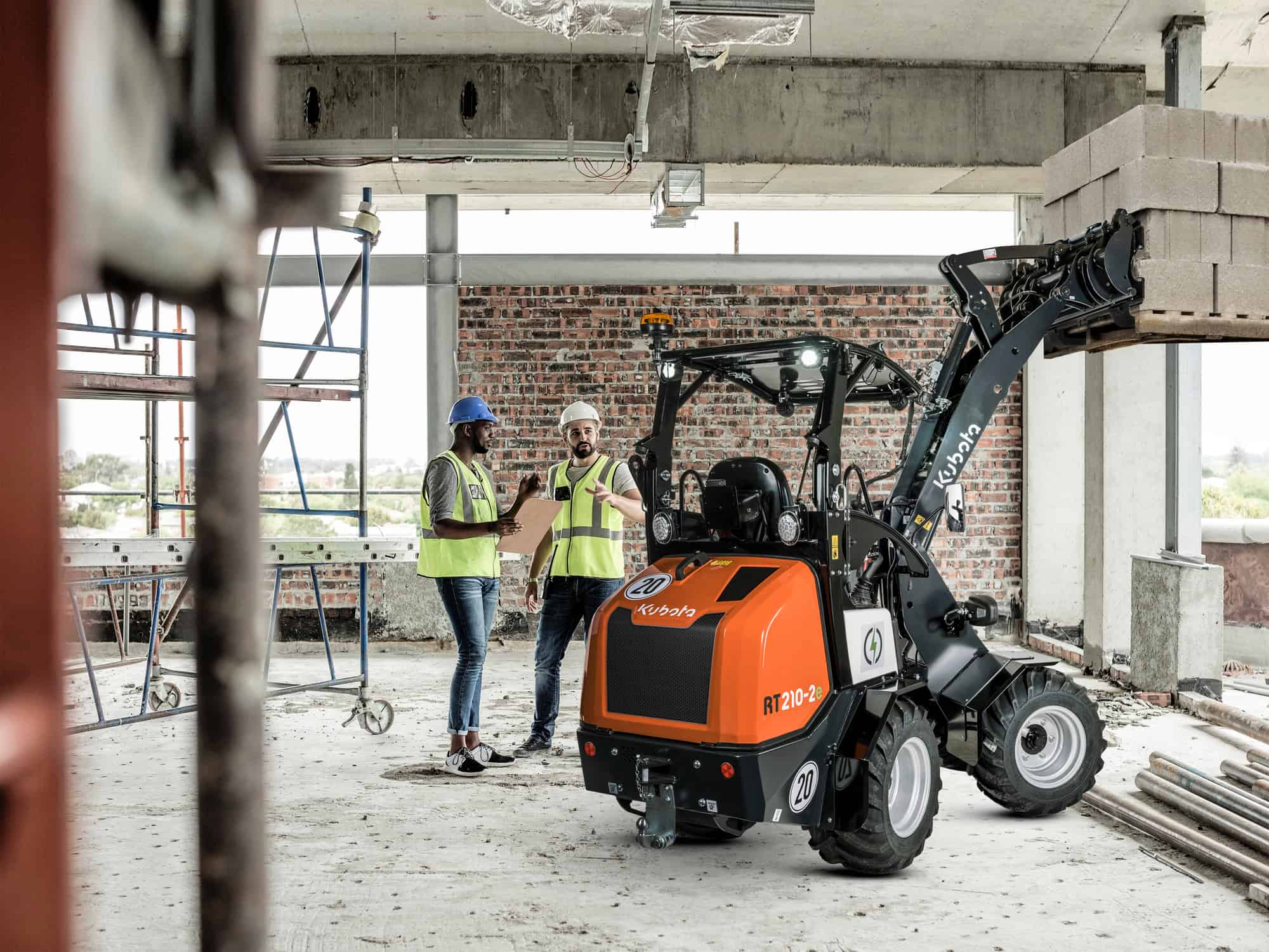 Construction workers discussing in construction site